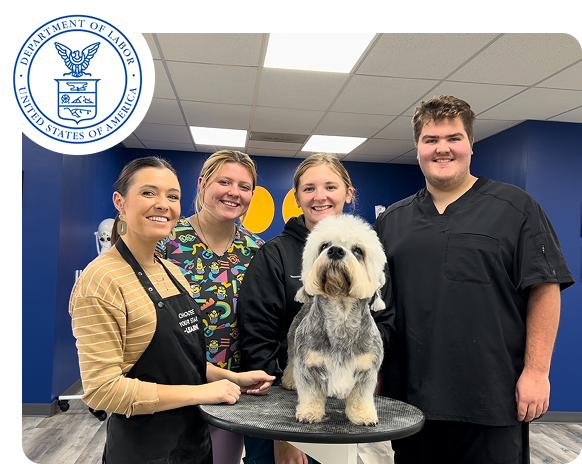 Groom Curriculum apprenticeship team with dog, recognized by the U.S. Department of Labor for professional dog grooming training